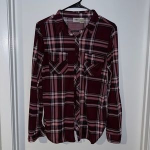 Burgundy flannel with black cross stitch in back. US size medium
